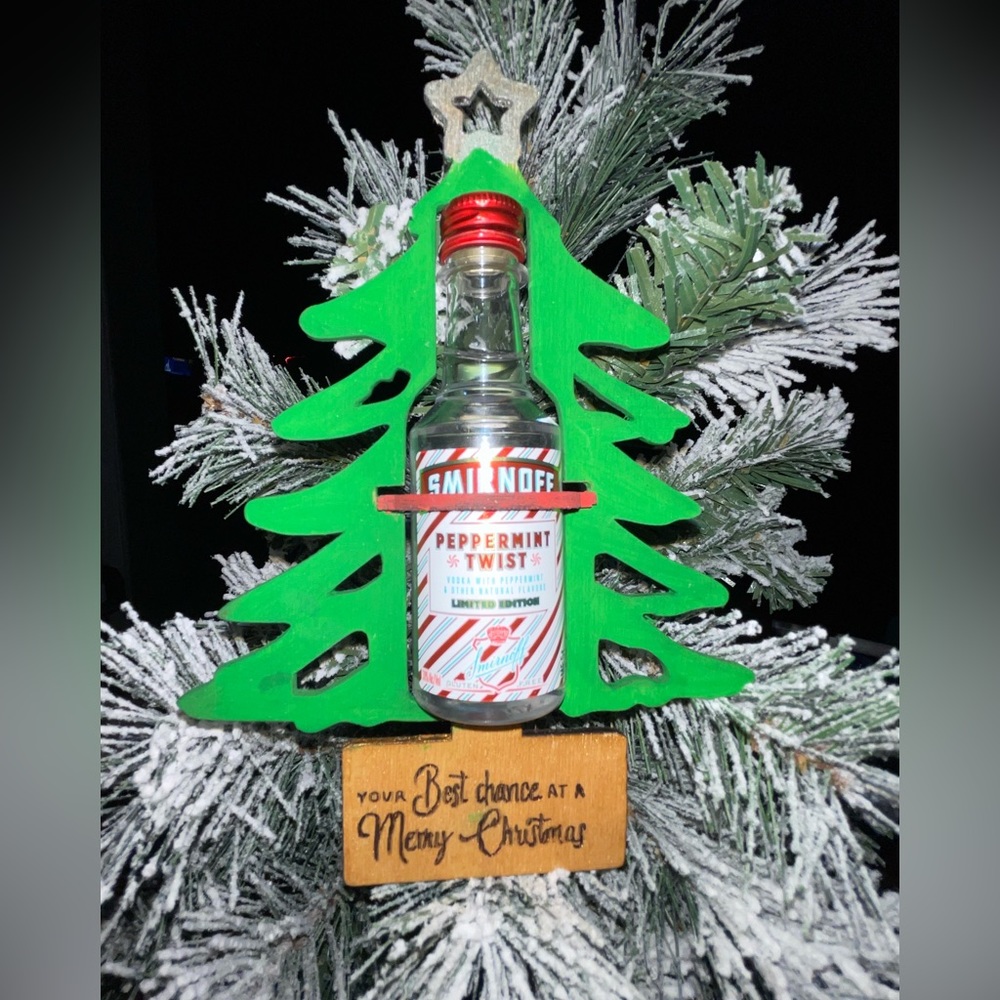 Christmas ornaments hold shot bottles